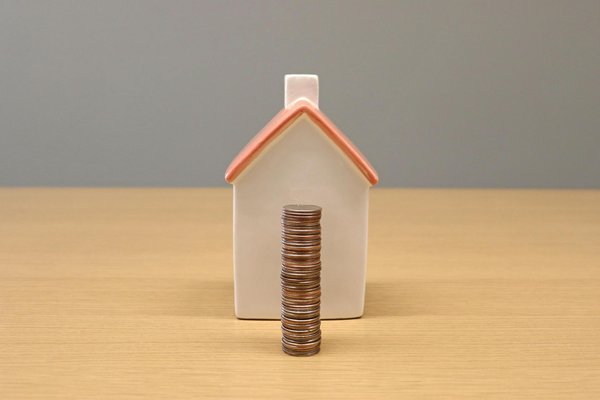 How is the UK government supporting the automotive industry's transition to green energy?